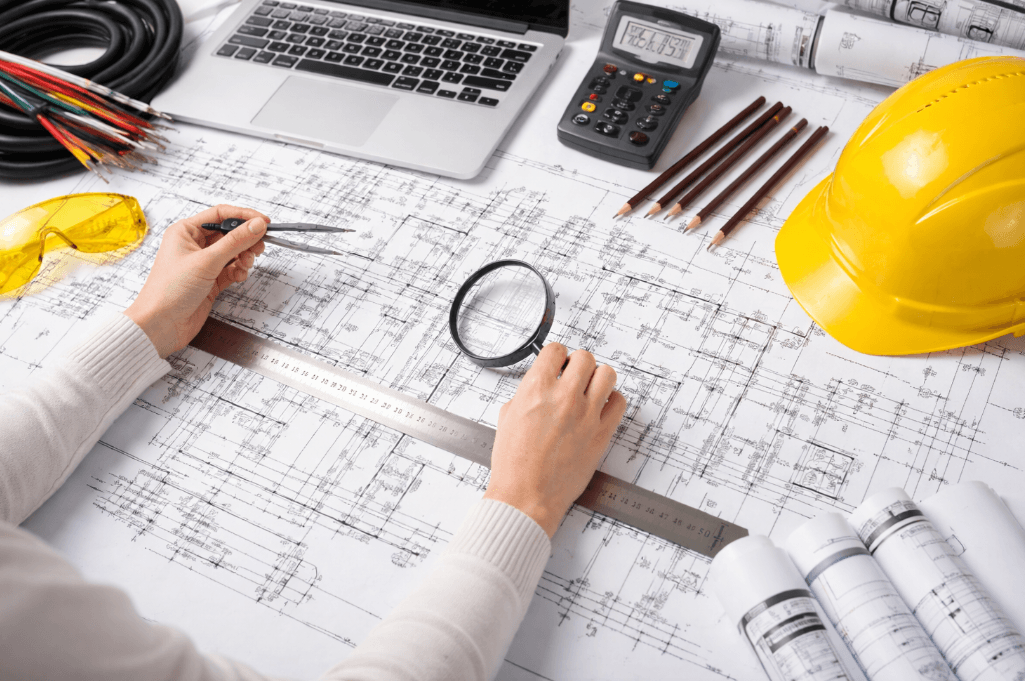 Engineer reviewing electrical blueprints